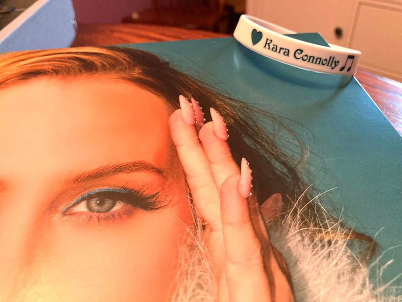 personalised wristband on corner of album cover