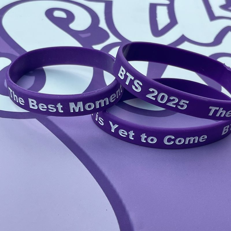 three purple and white wristbands for special occasion