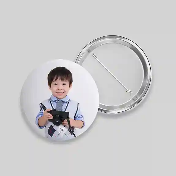 Pin button with young child in blue shirt