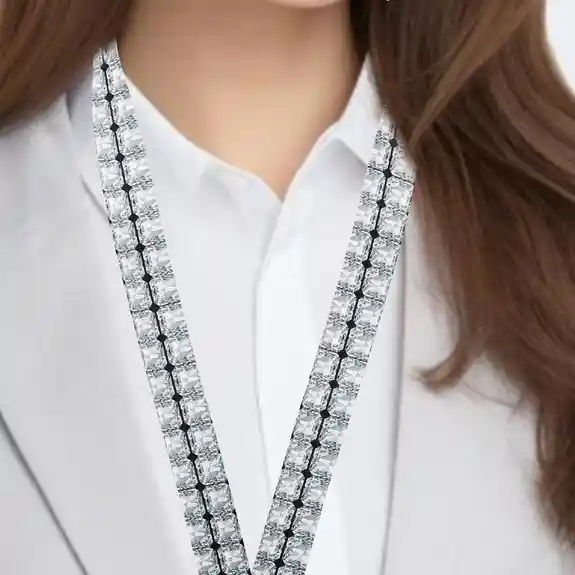 Woman wearing white shirt with diamond lanyard