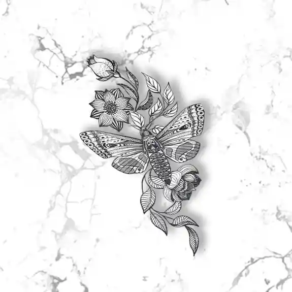 Black and white moth with botanical floral design