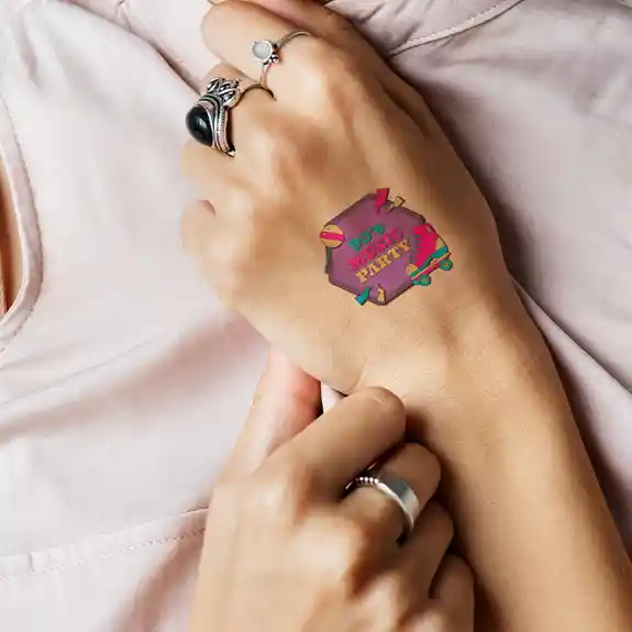 Nineties music party temporary tattoo on person\'s arm