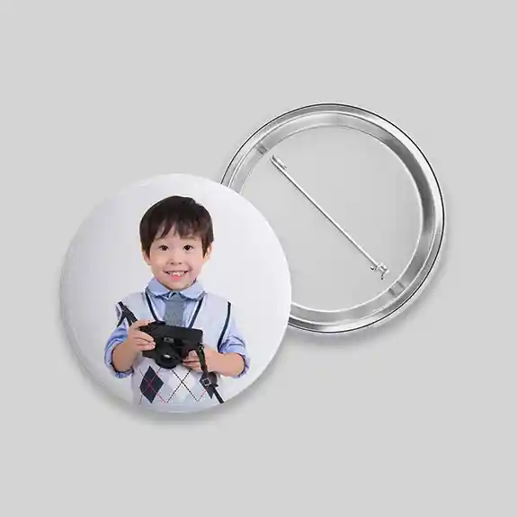 Pin button with young child in blue shirt